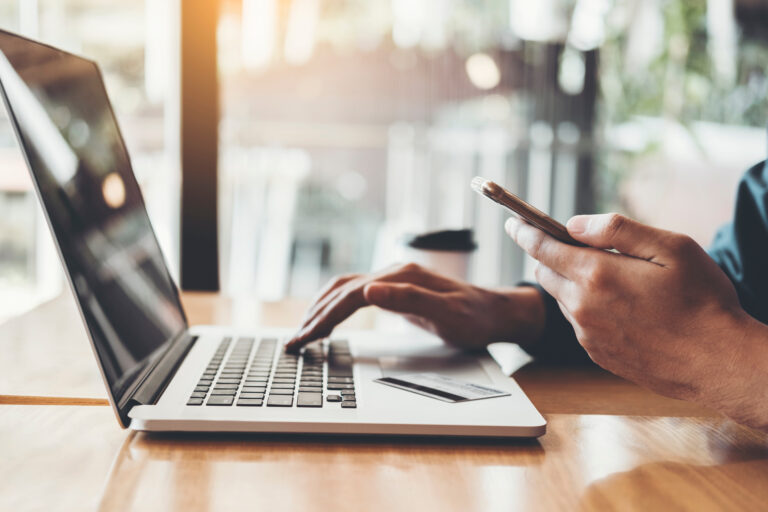 Businessman Using Laptop With Credit Card Shopping Online